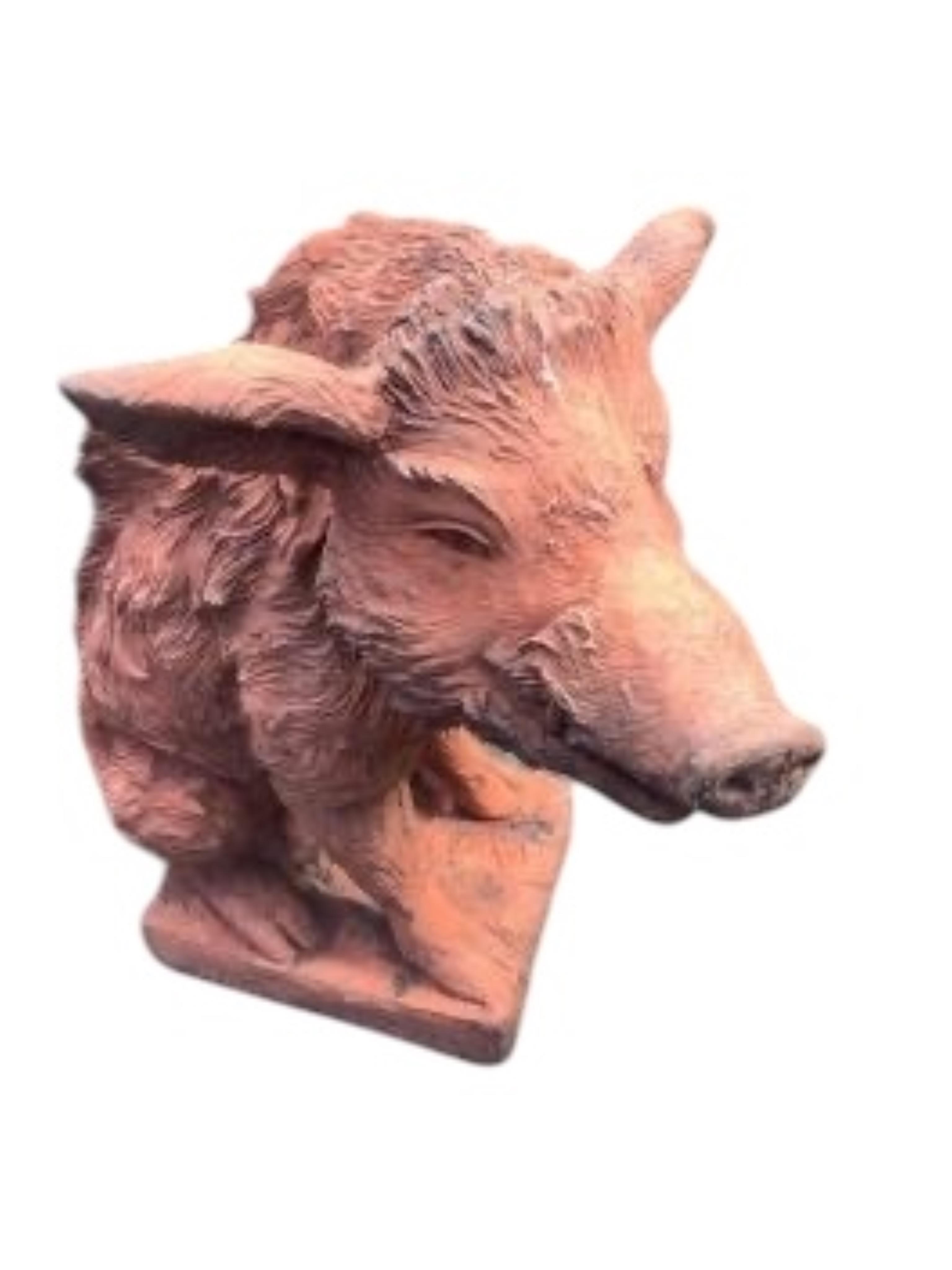 A pair of terracotta seated wild boar garden ornaments, height 55cm